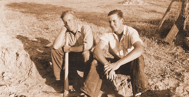 A photo from the Oregon Wine History Archive shows two men taking a break from work.##Oregon Wine History Archive