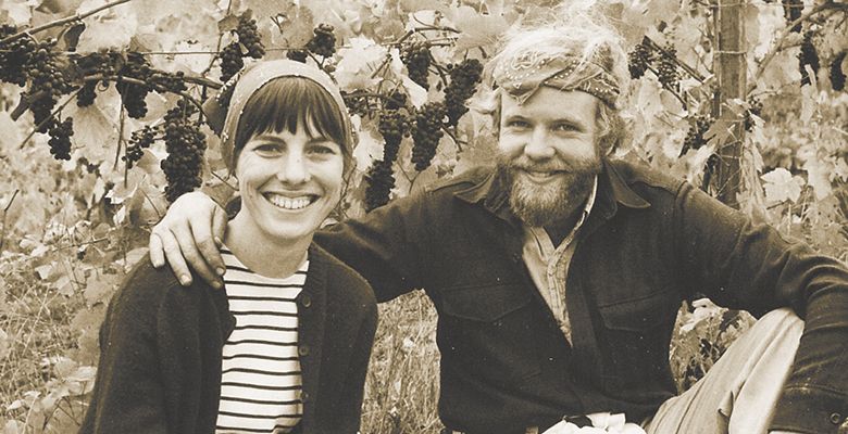 David and Diana take time under the vines for a snapshot during the first harvest in 1970.##Photo provided