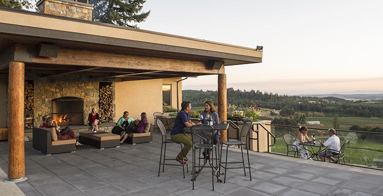 The outside fireplace on the terrace is yet another cozy nook to relax, sip wine and take in the scenery.##Willamette Valley photo by Andrea Johnson