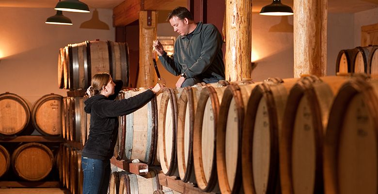 Greg and Kara Paneitz taste wine in the barrel at Wooldridge Creek Winery.##Photo provided