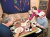 Olive You patrons Rick and Roxanne Robinson (left), and Ed and Jeanne DeRaeve are served by the restaurant&rsquo;s co-owner Marilyn Turner.
