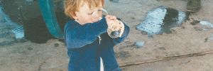 Sager Small sipping fresh grape juice during harvest. Taken during the late  80s at Woodward Canyon Winery, Small is now vineyard manager and winery co-owner. ##Photo courtesy of Woodward Canyon Winery