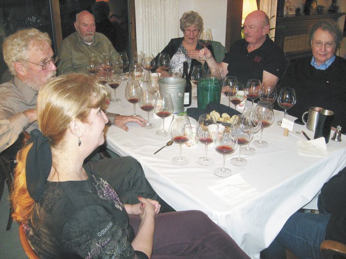 Participants in the 1985 Oregon Pinot tasting included co-host Judy Erdman (foreground), Amity Vineyards founder Myron Redford (behind Erdman) and Erath Vineyards founder Dick Erath (to Redford’s left), among others. The group gathered at Erdman’s home in Portland. Photo by Karl Klooster.