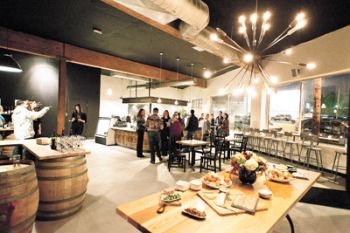 During the grand opening of Cyril&rsquo;s at Clay Pigeon Winery in Southeast Portland, guests sample food and enjoy glasses of wine. 
