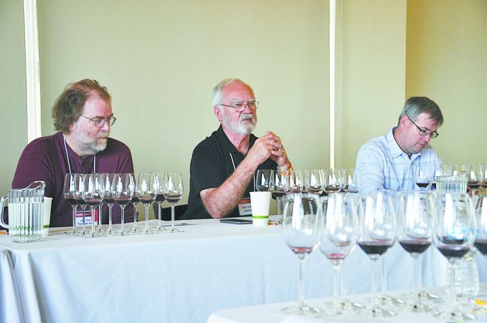 Earl Jones (center), founder of Abacela, and Jeff Stai (left), founder of Twisted Oak Winery in Calaveras County, Calif., lead a discussion during the “Aged and New Tempranillo” seminar at the 2014 TA PAS Grand Tasting. Photo by Eddie Hernandez
