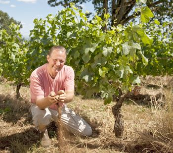 Russ Raney of Evesham Wood plays in the dirt at Le Puits Sec Vineyard in Salem.
