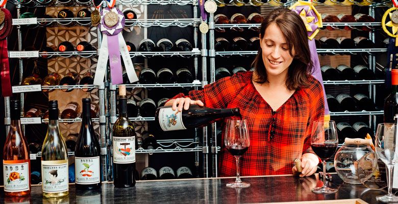 Anna Mantheakis pours a sample for tasters at Quady North’s tasting room in Jacksonville. ##Photo by Kathryn Elsesser
