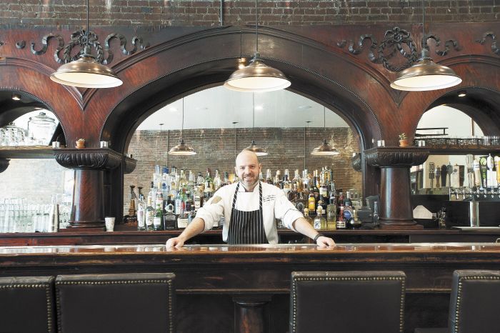 Chris Czarnecki behind the bar at The Barlow Room, the Joel Palmer House executive chef’s new Dayton restaurant.Photo by Marcus Larson