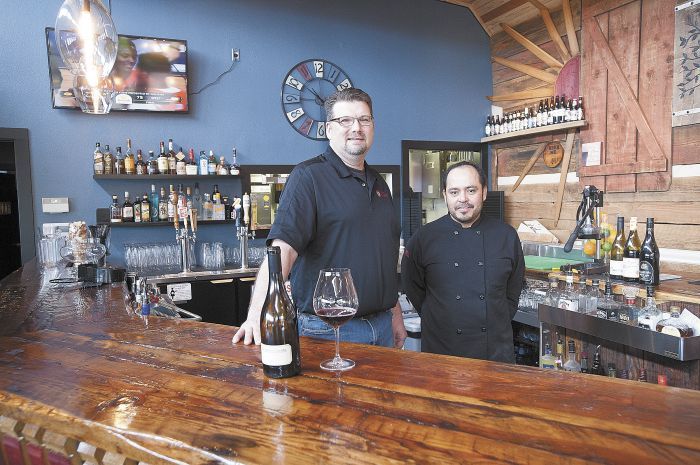 Barrel 47 owner Andy Rabung and chef Bono Solorzano behind the custom bar at the new Carlton eatery.