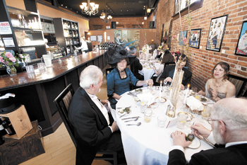 Period-attired Jerry and Susan Murphy enjoy the oysters Rockefeller at Latitude one&rsquo;s titanic 100th anniversary dinner in Dallas, OR