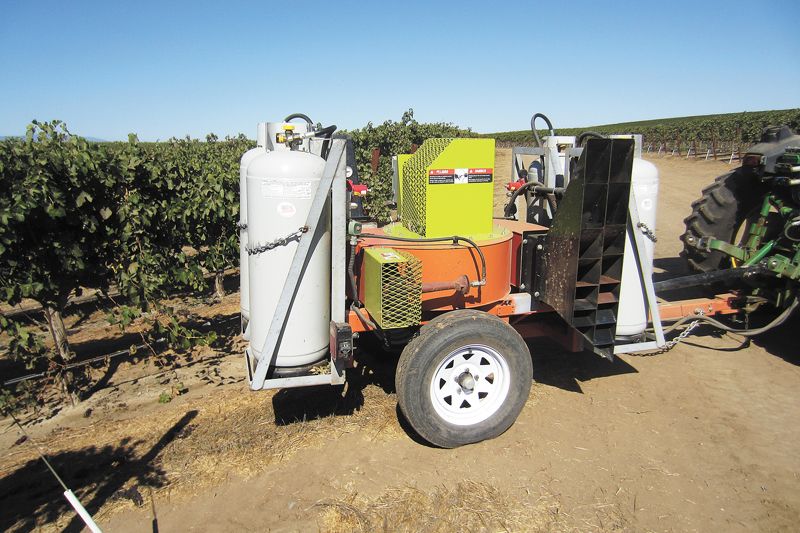 Agrothermal Systems manufactures equipment that blows hot air (300°F) into the canopy from propane-powered jets in order to control pests and diseases without harming the grapevine. Additional benefits include assuring fruitset and improving wine quality. ##Photo courtesy of Agrothermal Systems