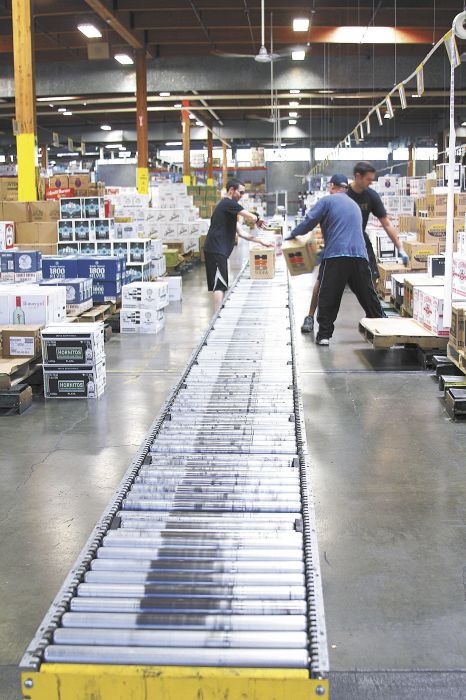 Frequently ordered items stand adjacent to the main conveyer line at the OLCC’s 230,000-square-foot warehouse in Southeast Portland. Photo provided.