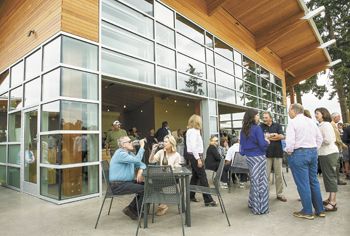 Guests gather on the patio at the new Stoller tasting room in Dayton during its grand opening on Sept. 9.