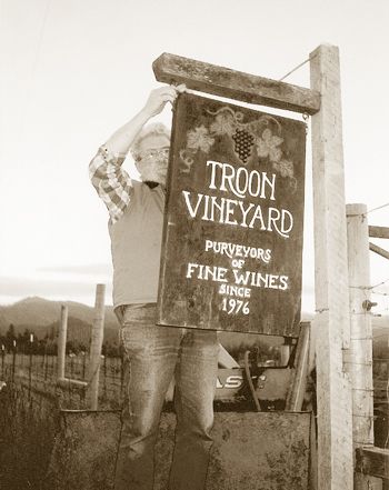 A young Dick Troon hangs a winery sign in 1976 at his Applegate Valley vineyard.
Photo provided.