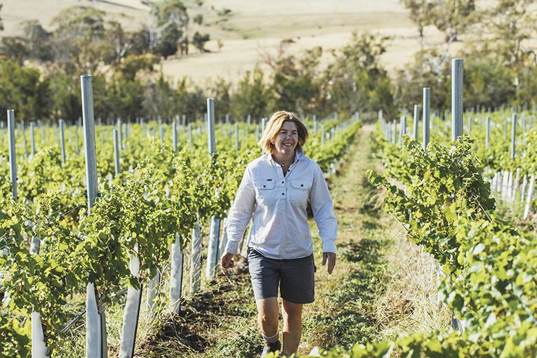 Stargazer Wines’ Samantha Connew strolling through a Tasmanian vineyard. ##Photo provided by Wine Australia