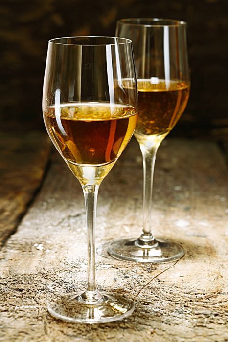 Sherry is produced in a variety of dry styles made primarily from the Palomino grape, ranging from light versions similar to white table wines, such as Manzanilla and Fino, to darker and heavier versions that have been allowed to oxidize as they age in barrel, such as Amontillado and Oloroso.