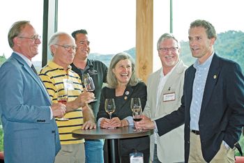 From left, Chris Lake, director of SOWI; Earl Jones of Abacela; Chris Martin of Troon Vineyard; Deb Hatcher of REX HILL and A to Z Wineworks; Michael Donovan of RoxyAnn Winery; and Tom Danowski, executive director of the Oregon Wine Board, enjoy wine and hors d’oeuvres at the Southern Oregon marketing and sales conference. Photo by Kim Lewis