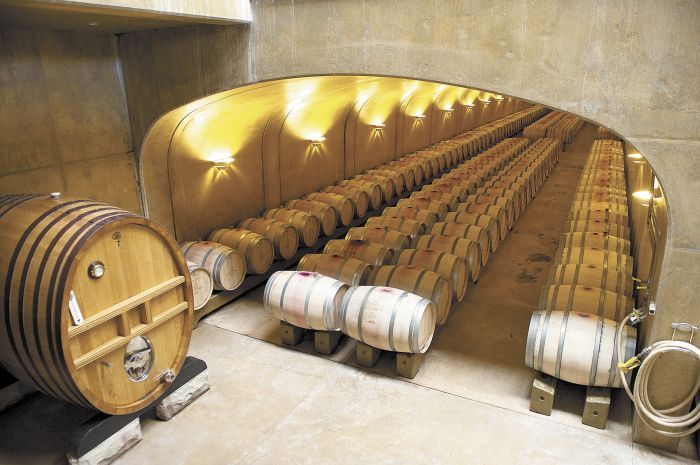 Inside the underground barrel room, Leonetti wines age for 15 to 22 months in French oak.