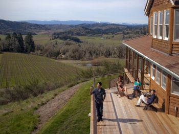 Guests soak up the sun on Youngberg Hill Inn&rsquo;s new deck. Located near McMinnville, the inn boasts some of the best views in the entire Willamette Valley. Owners Wayne and Nicolette Bailey also make wine by the same name. Photo provided.